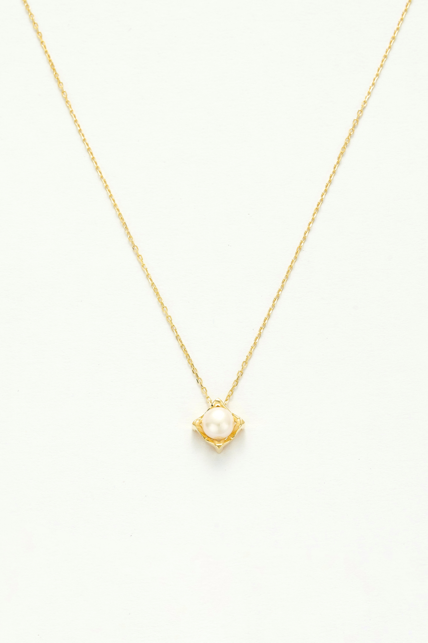 Opulent Pearl Gold Charm Necklace